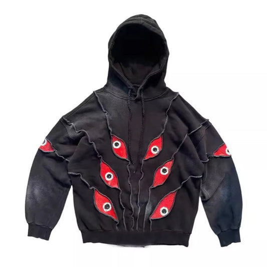 Unisex Black Red Eye Patchwork Hoodie - primary photo, shown with a person