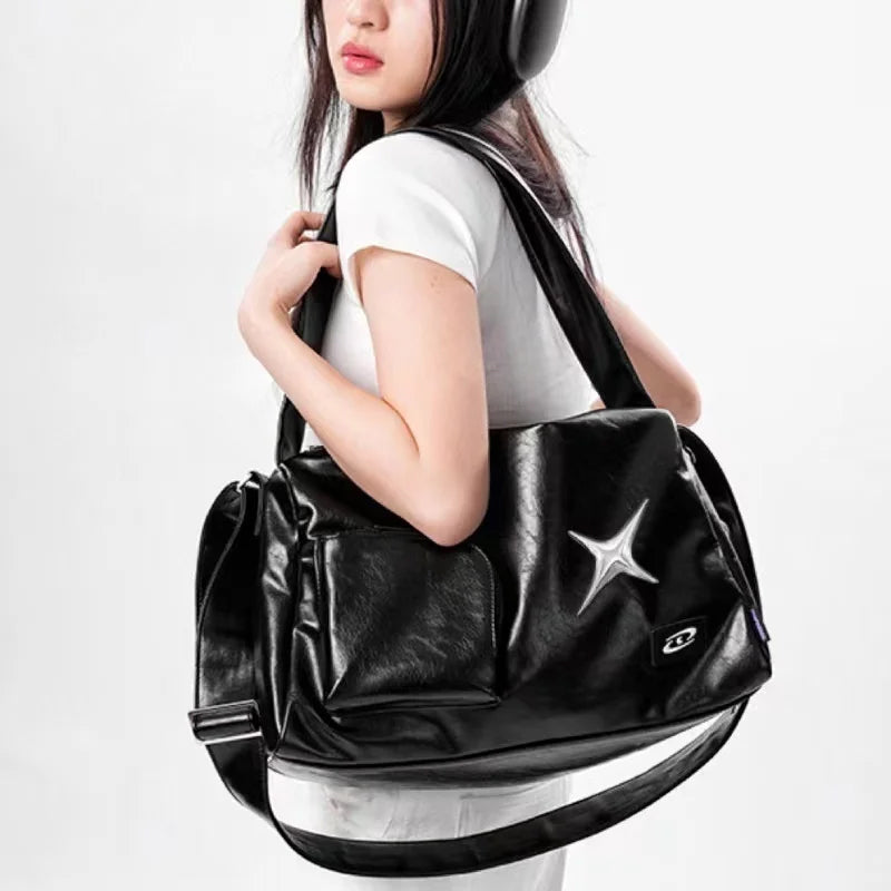 Women's Black Star-Emblem Faux Leather Tote - primary photo, shown with a person (1 of 3)