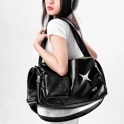 Women's Black Star-Emblem Faux Leather Tote - primary photo, shown with a person (1 of 3)