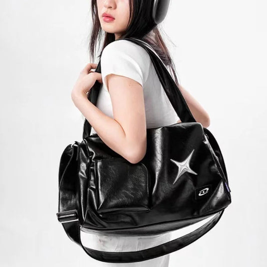 Women's Black Star-Emblem Faux Leather Tote - primary photo, shown with a person (1 of 3)