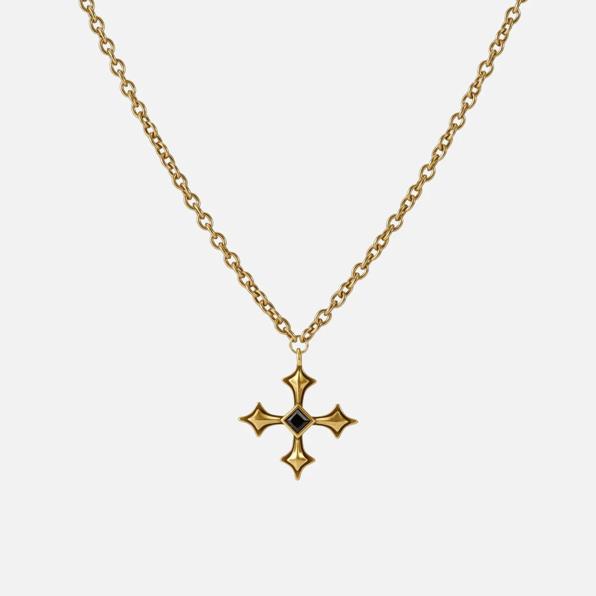 Black Testament Necklace in antiqued 18K gold with a gothic cross pendant and black obsidian, shown full length on white.