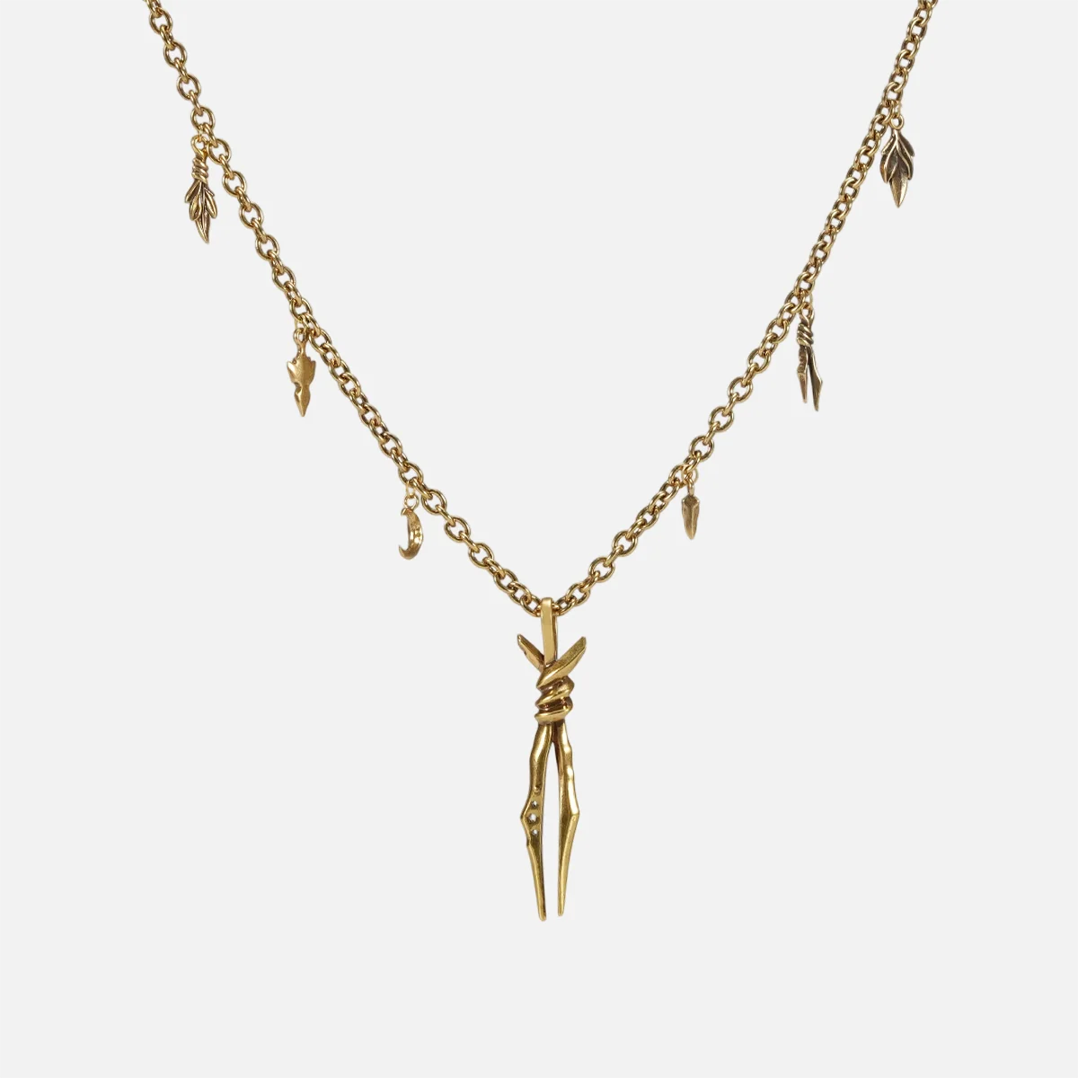 The gold-tone Bound Twin Necklace features a twin spike pendant and an antiqued charm chain.