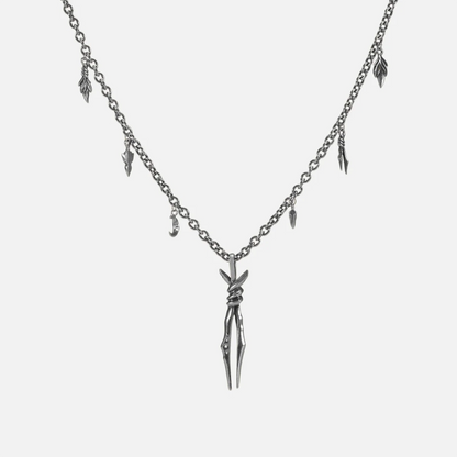 The silver-tone Bound Twin Necklace features a twin spike pendant, leaf charms, and an antiqued finish.
