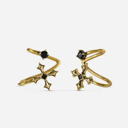 Bound Vestige Ear Cuffs in antiqued 18K gold with black obsidian and cross-inspired metalwork on a white background.