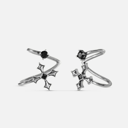 Bound Vestige Ear Cuffs in antiqued silver with black obsidian and cross-inspired metalwork on a white background.