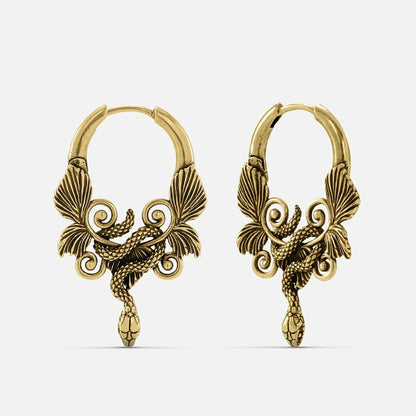 Pair of antique gold-tone hoop earrings featuring a coiled serpent and wing design, front view