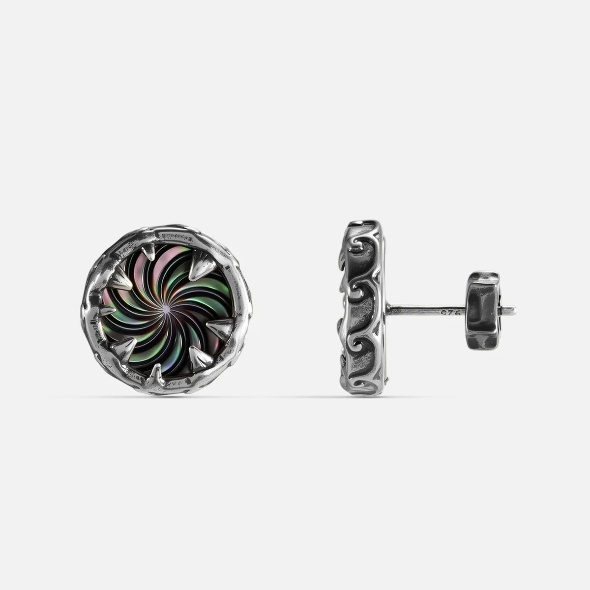 Silver Charybdis Maw Ear Studs with abalone shell spiral center, tooth-like rim, carved side texture, and flat back post on a clean background.