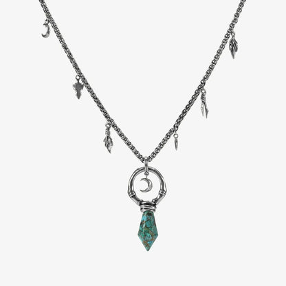 Crescent Ward Necklace in silver plating with crescent moon ring, turquoise spike pendant, and antiqued finish