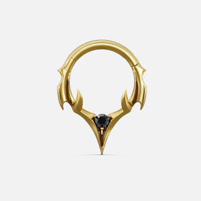 Gold-tone septum clicker ring with spiked crest design and a black center gemstone, front view