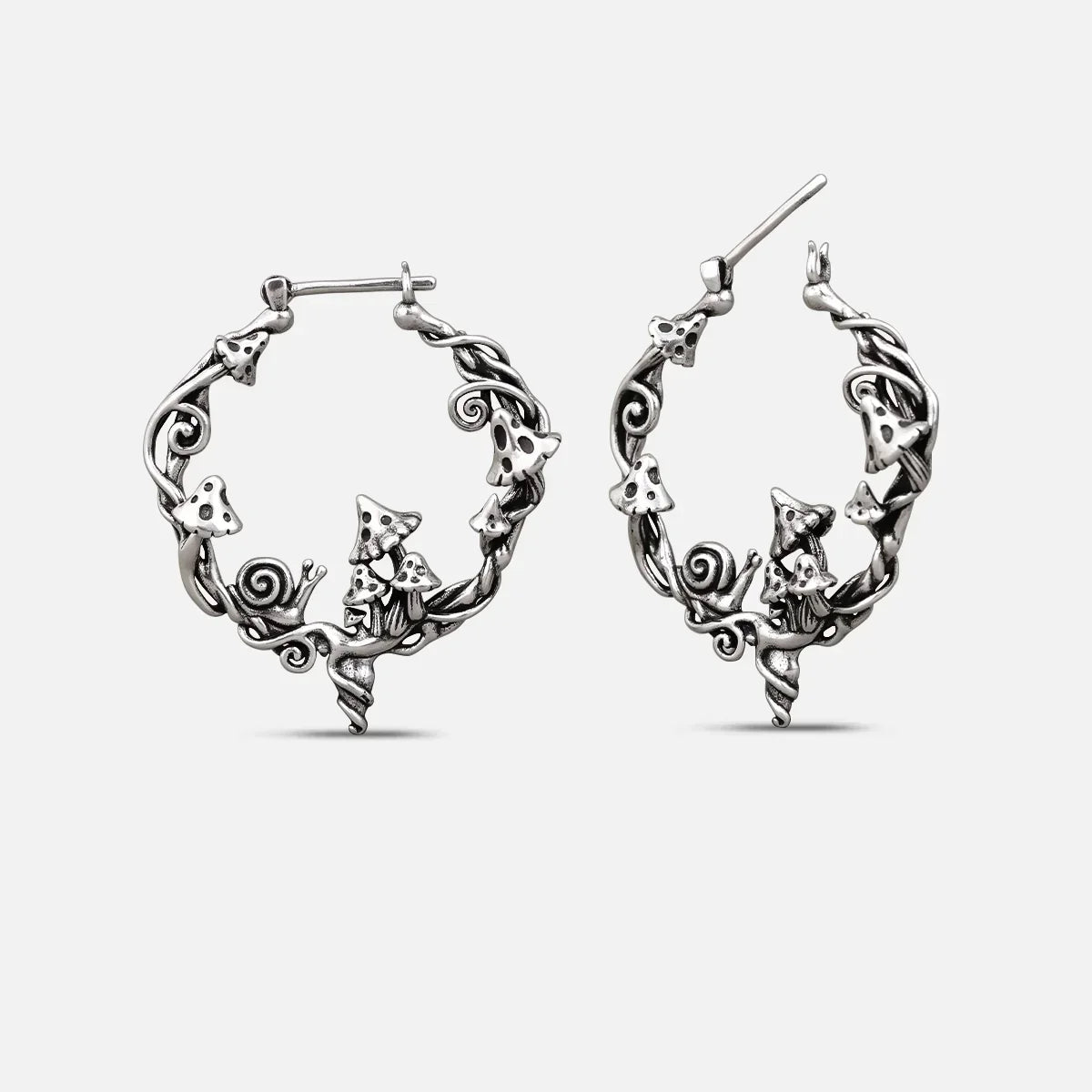 Silver-tone Enchanted Forest Whimsy hoop earrings with mushrooms, leaves, and woodland details
