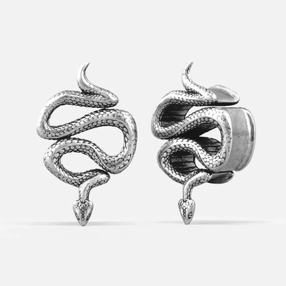 Pair of silver-tone coiled serpent tunnel earrings shown front and side view