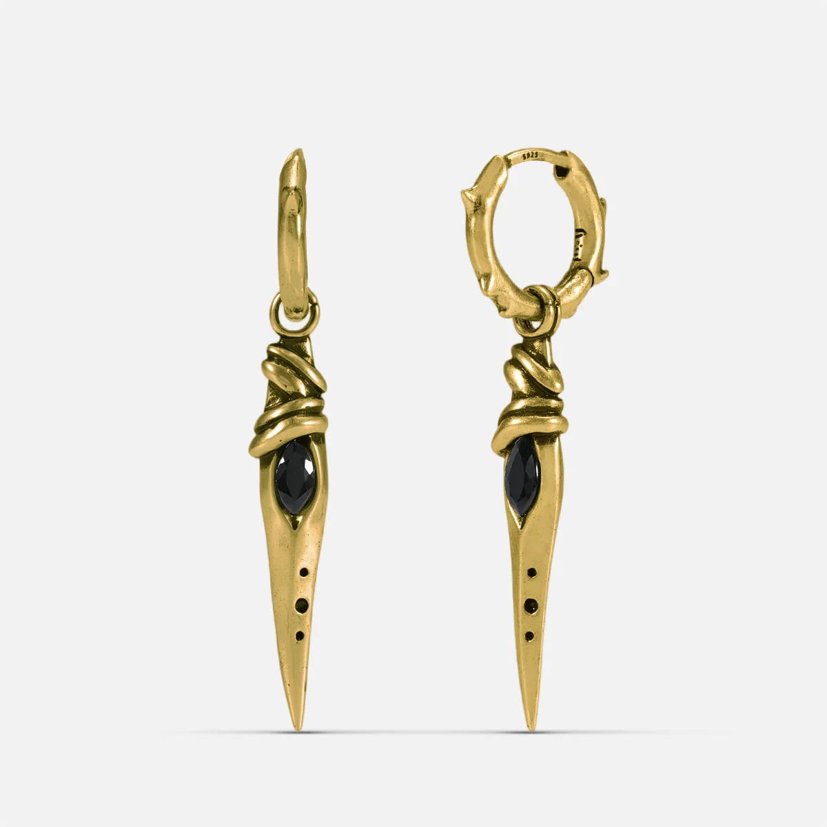 Gold-tone Eye Dagger Earrings feature eye-shaped stone inlays and dagger drop pendants.