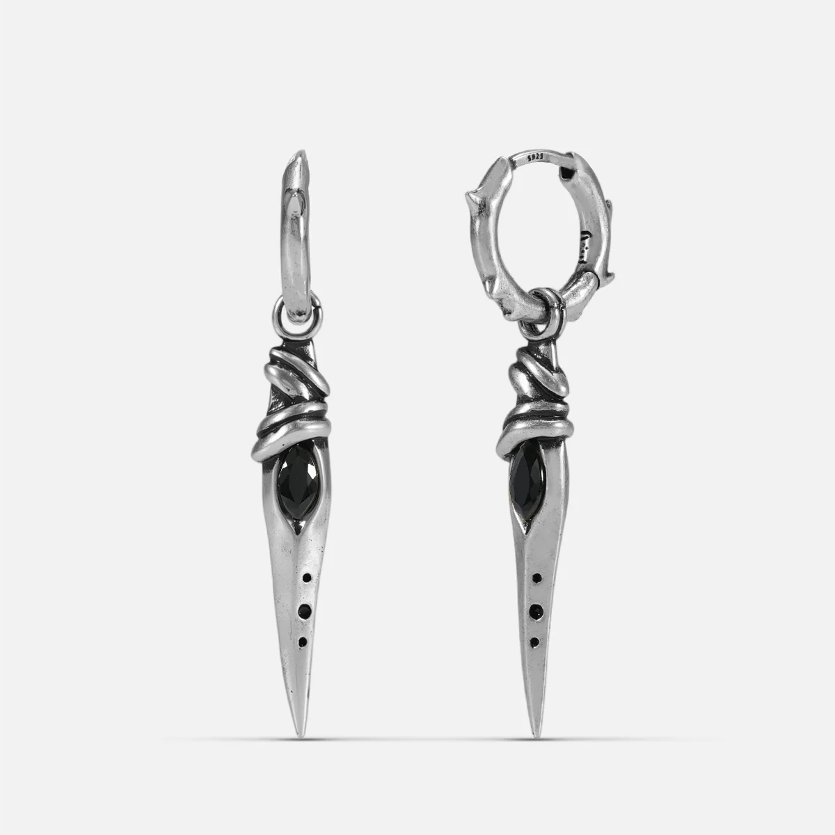 Silver Eye Dagger Earrings with black obsidian eye-shaped stones, slim dagger drops, and hammered hoop details on a clean background.