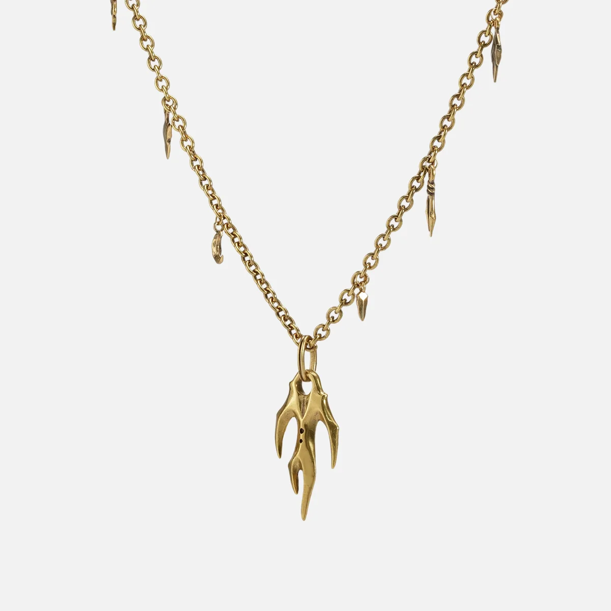 Feral Husk Necklace in 18K gold plating with antiqued claw pendant and charm chain