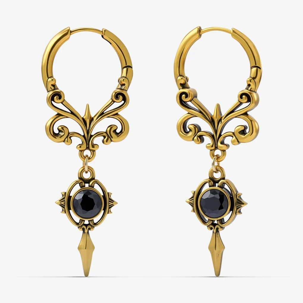 Pair of gold-tone Gothic Crest hoop earrings with scrolling filigree, black oval stones, and pointed drops