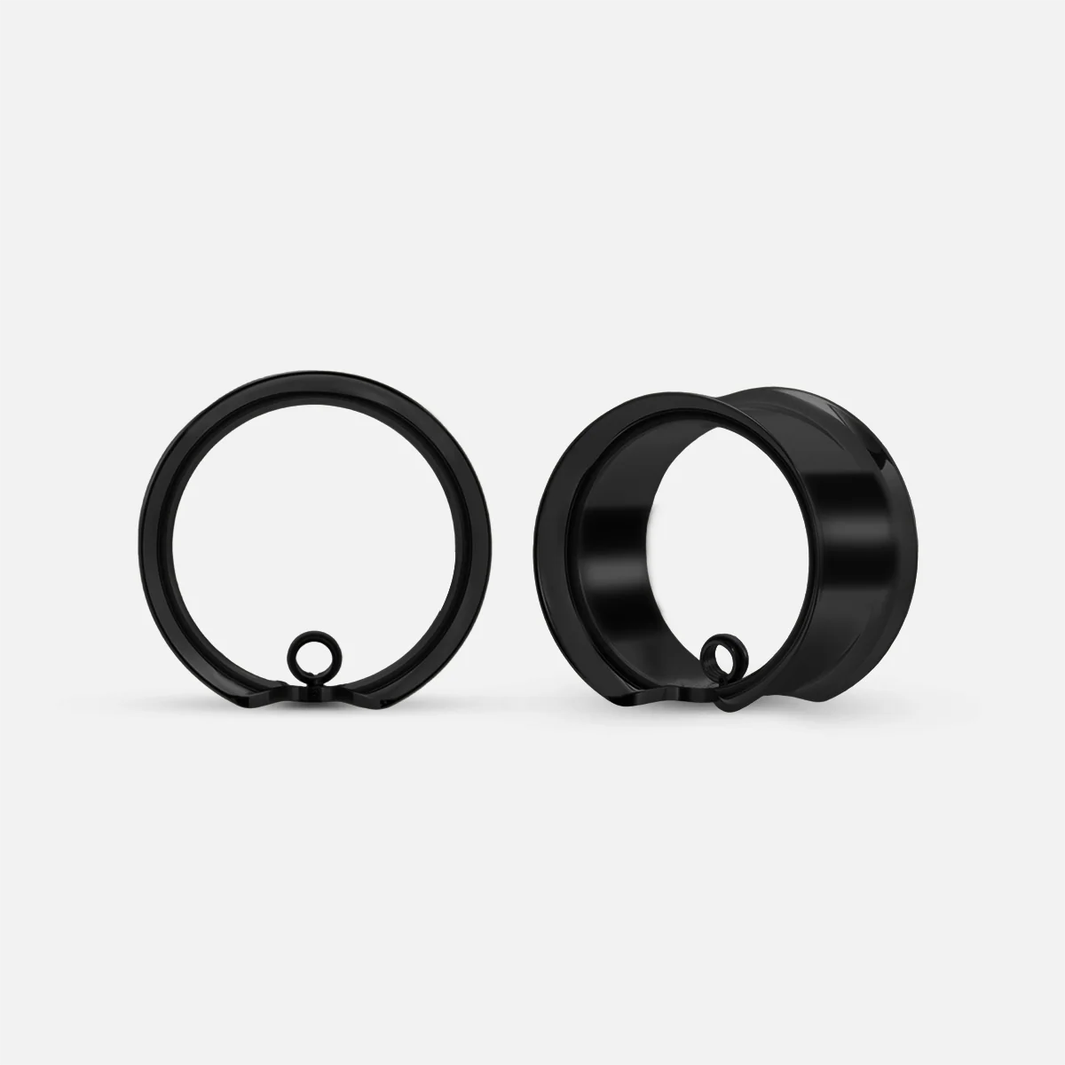Black modular ring tunnels shown from the front and side with a small attachment loop at the base