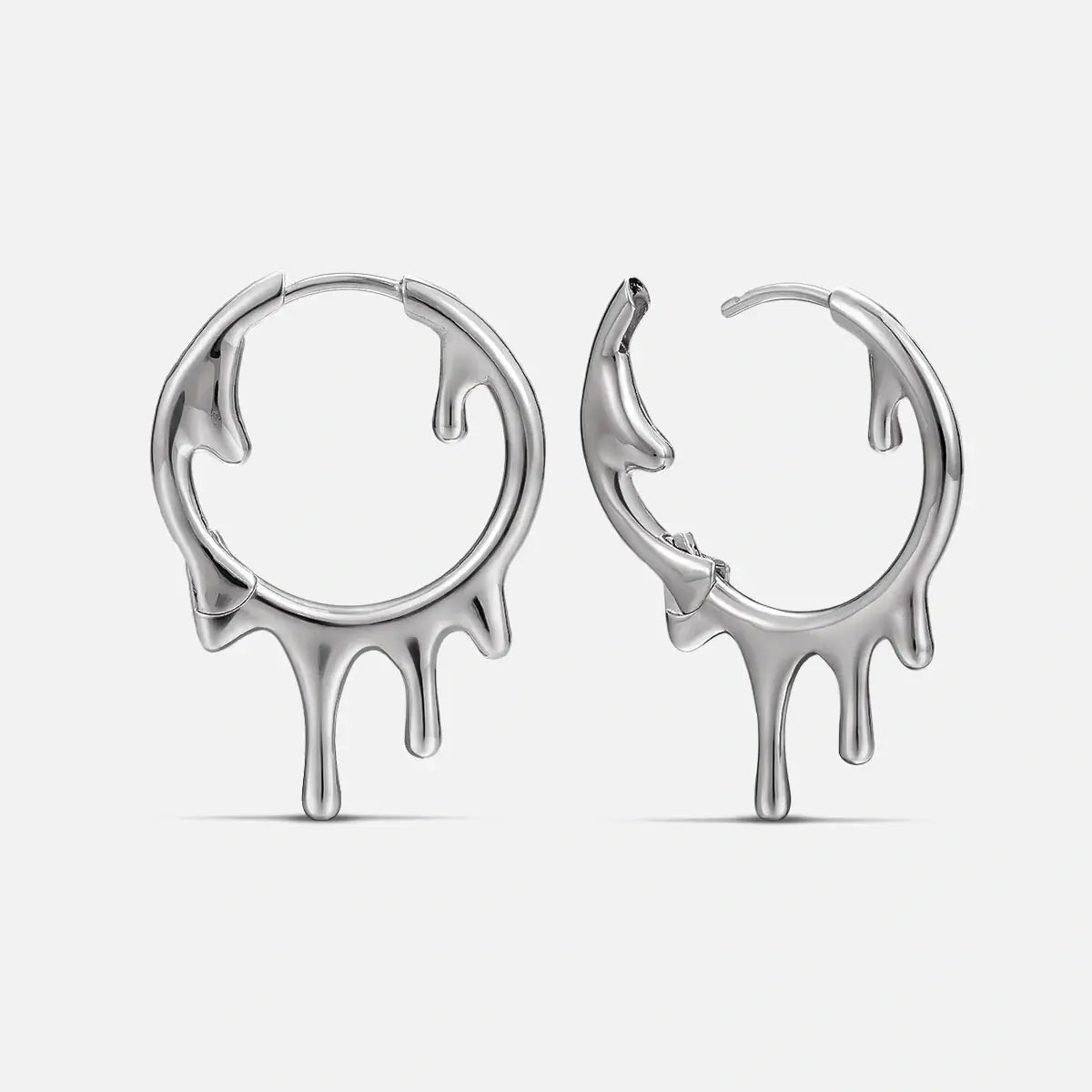 Molten Drop Earrings in 925 sterling silver, pair shown front and side on white, highlighting the sculpted molten-drip hoop s