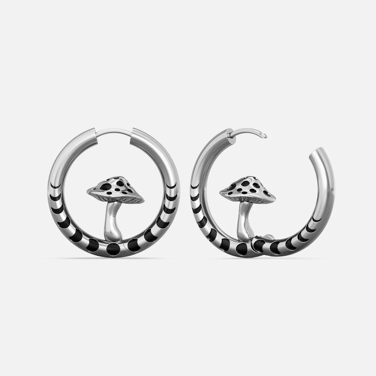 Silver-tone hoop earrings with striped bands and a mushroom charm centered in each hoop, front view