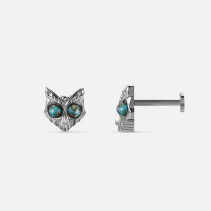 Owl Skull Ear Studs in polished titanium with turquoise stone eyes and sharp owl skull design