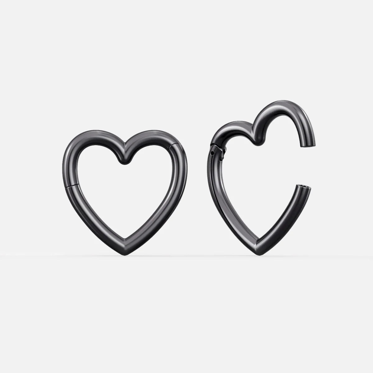 Pair of black Romantic Heart ear weights with open heart shapes