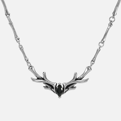 Silver Sacred Antler Collar Necklace with black obsidian stone, antler-shaped centerpiece, and bone-inspired chain details on a clean background.
