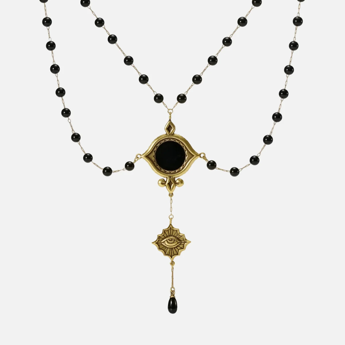 Gold-tone Scrying Mirror Necklace displayed from the front with doubled black bead chains, an oval black obsidian centerpiece, and a teardrop accent.