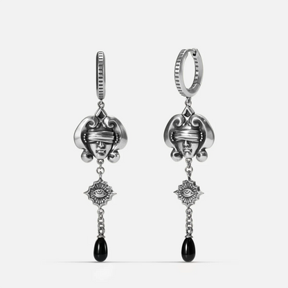 Antiqued silver-tone Second Sight Drop Earrings shown from front and side views with blindfolded face motifs, radiant eye medallions, and black teardrop accents.