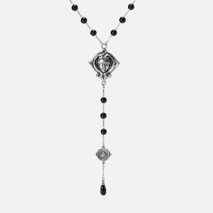Antiqued silver-tone Second Sight Lariat Necklace with black beads, a blindfolded face motif, an eye medallion, and a black teardrop.