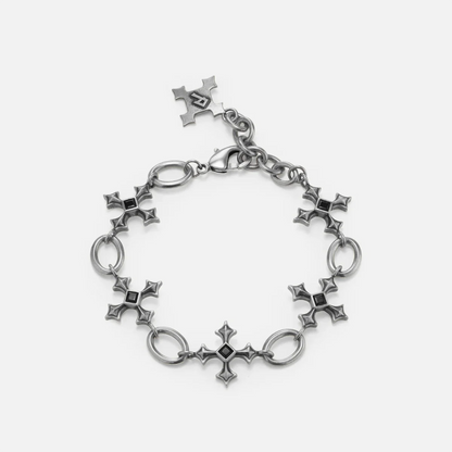 Silent Litany Bracelet in antiqued silver with gothic cross-inspired links and black obsidian, shown in a full circle on whit