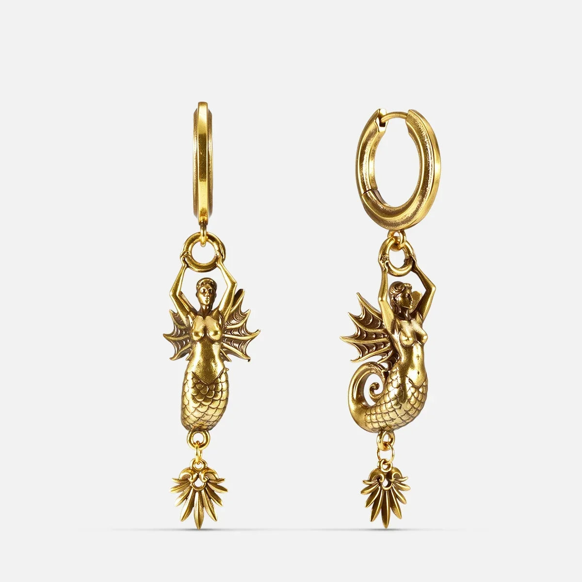 Gold Siren's Dirge Earrings with sculpted siren figure, scaled tail, sharp fins, dangling charm, and hoop design on a clean background.