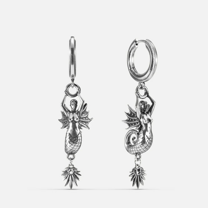 Silver Siren's Dirge Earrings with sculpted siren figure, scaled tail, sharp fins, dangling charm, and hoop design on a clean background.
