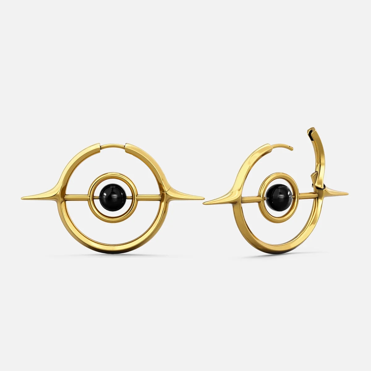 Gold-tone Stellar Grace hoop earrings with spike details and a black stone center, shown front and side view