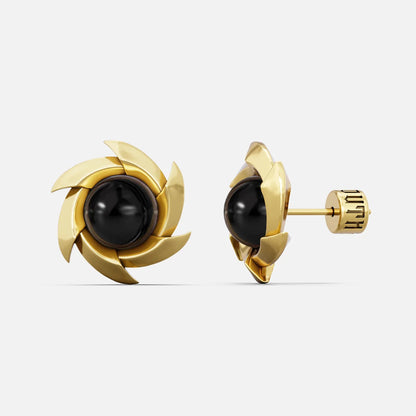 Gold-tone pinwheel stud earrings with a round black stone, front and side view