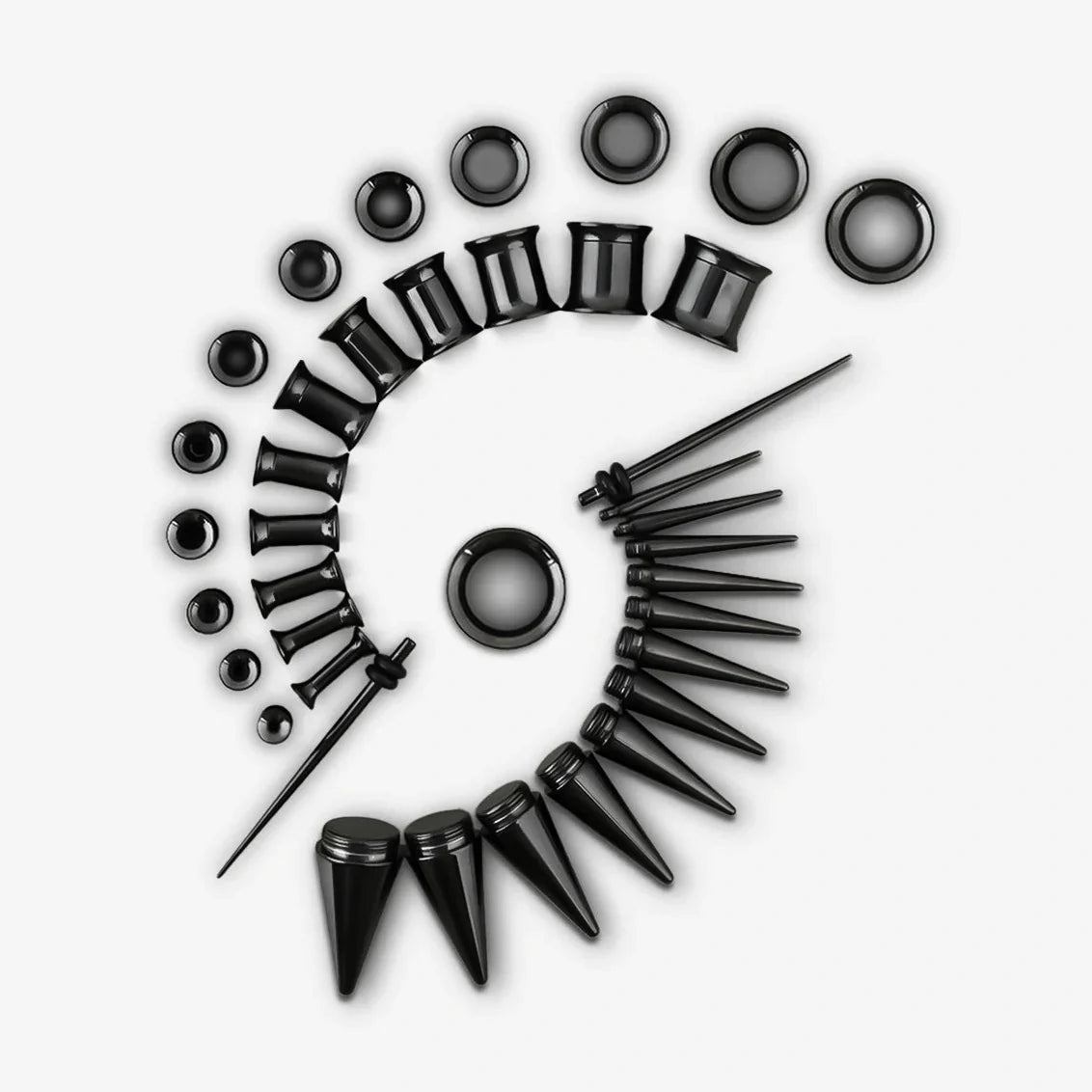 Black ear stretching kit with tapers, tunnels and plugs arranged in a spiral pattern