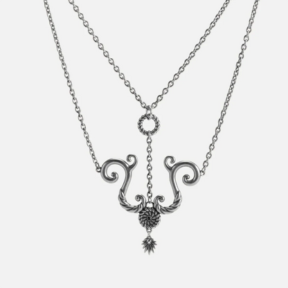 Tideworn knot necklace in antiqued silver finish with rope textured ring and layered spiral pendant