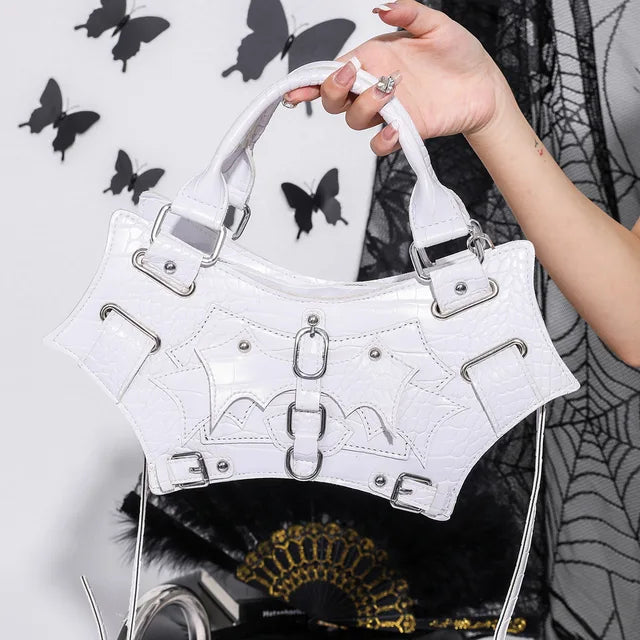 Women's Black Croc Bat-Wing Buckle Handbag - alternate view, shown with a person (2 of 2)