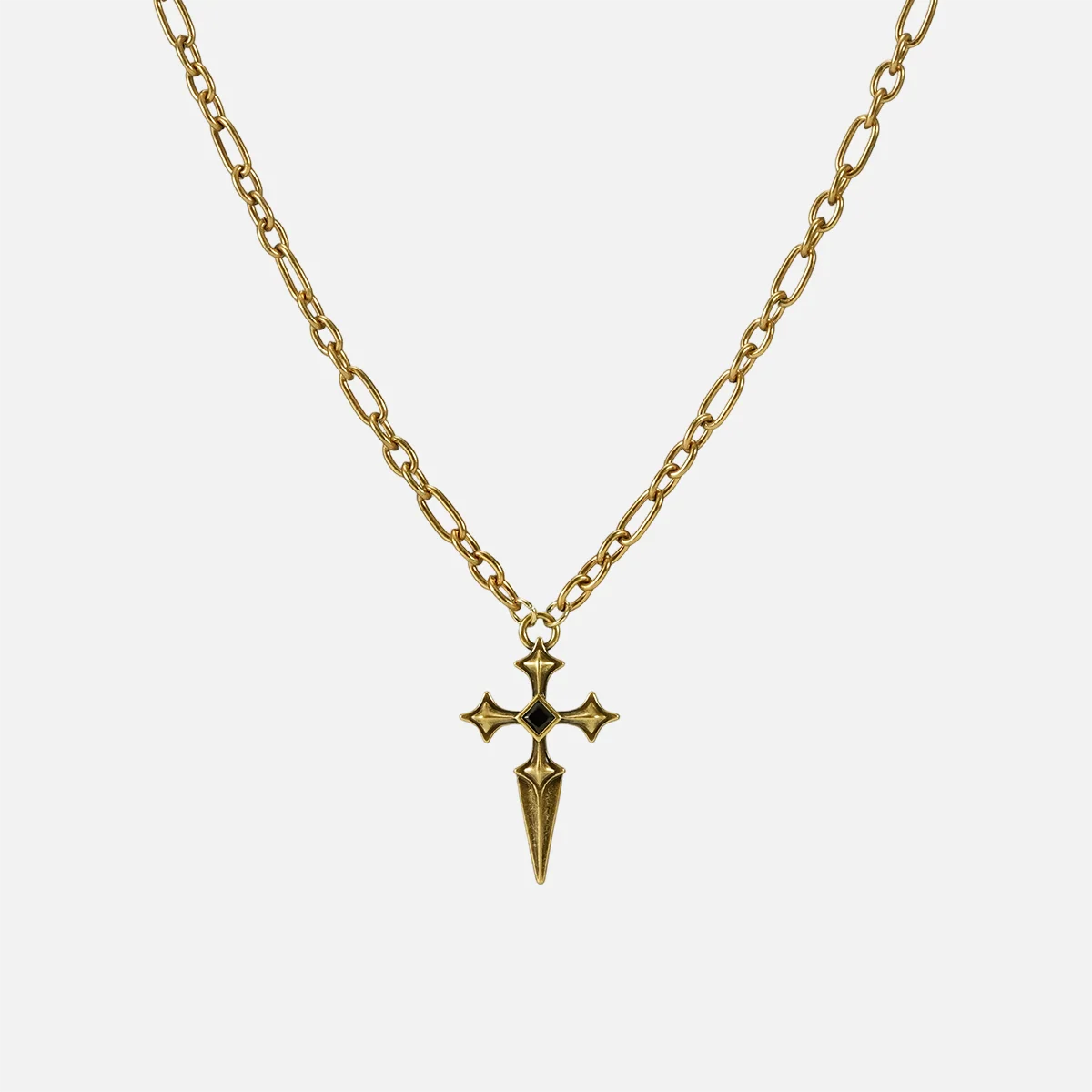 Vesper Blade Necklace in antiqued 18K gold with a blade-shaped cross pendant and black obsidian, shown full length on white.