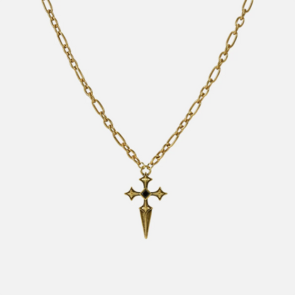 Vesper Blade Necklace in antiqued 18K gold with a blade-shaped cross pendant and black obsidian, shown full length on white.