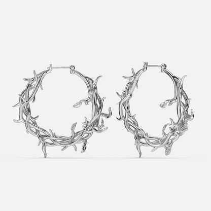 Pair of silver-tone hoop earrings featuring an intertwined vine and thorn design