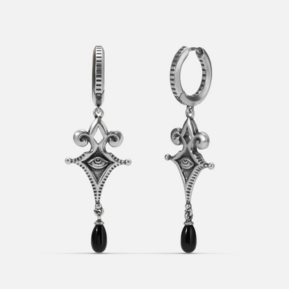 Antiqued silver-tone Watcher’s Tear Earrings shown from front and side views with engraved eye motifs and suspended black teardrop accents.