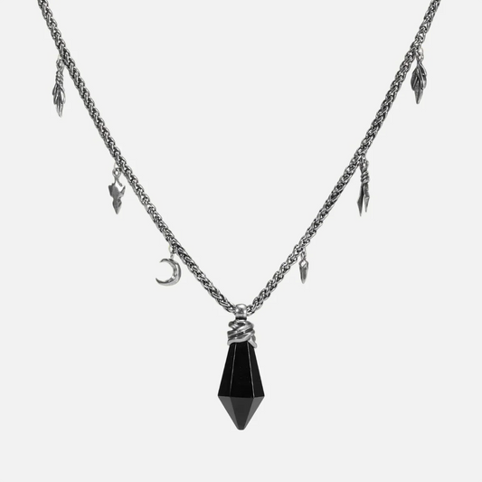 Black obsidian Wrapped Relic Necklace in silver tone, featuring a bound raw stone pendant, crescent charm, and relic-like chain details.